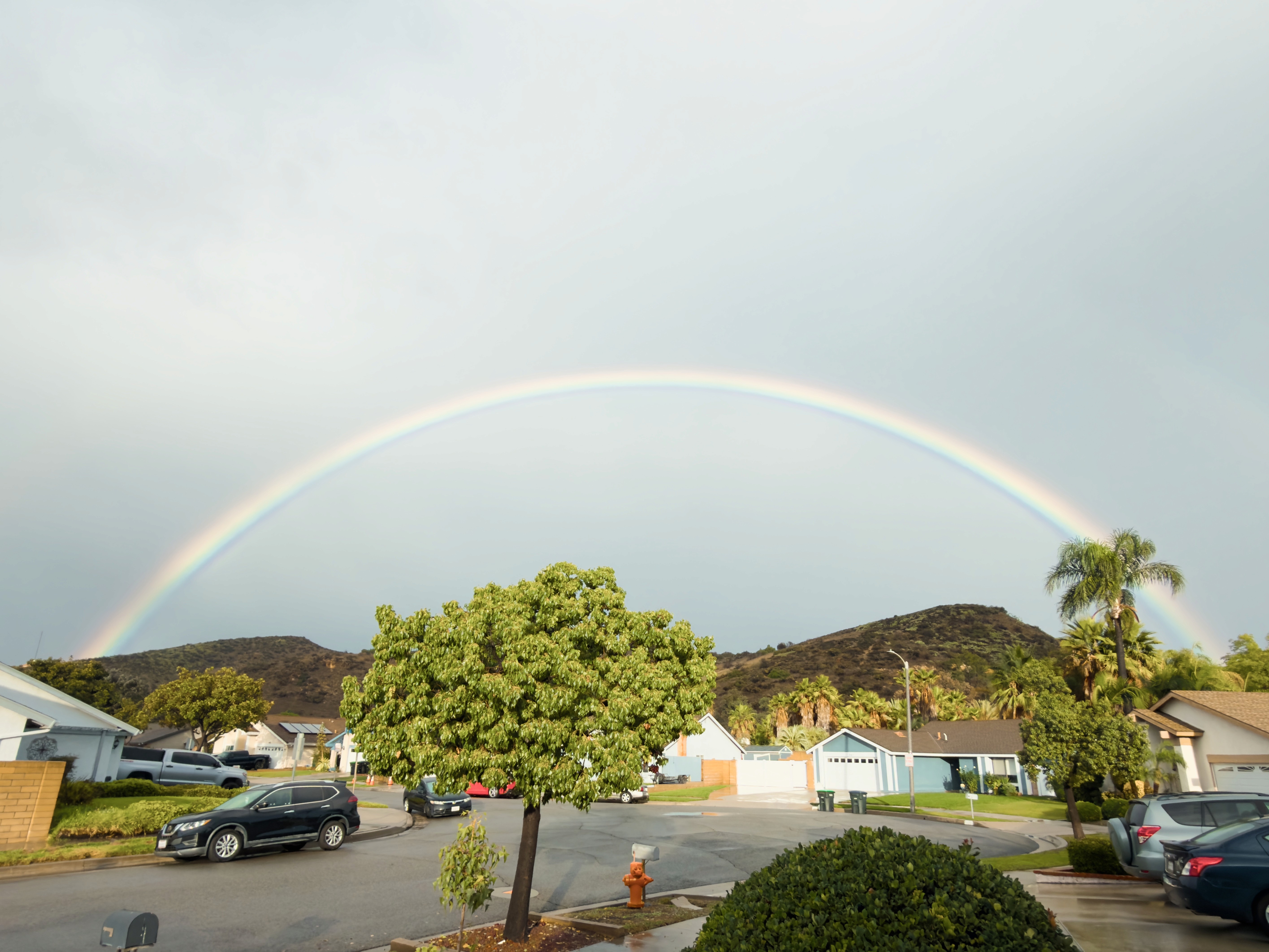 Full rainbow on cloudy day