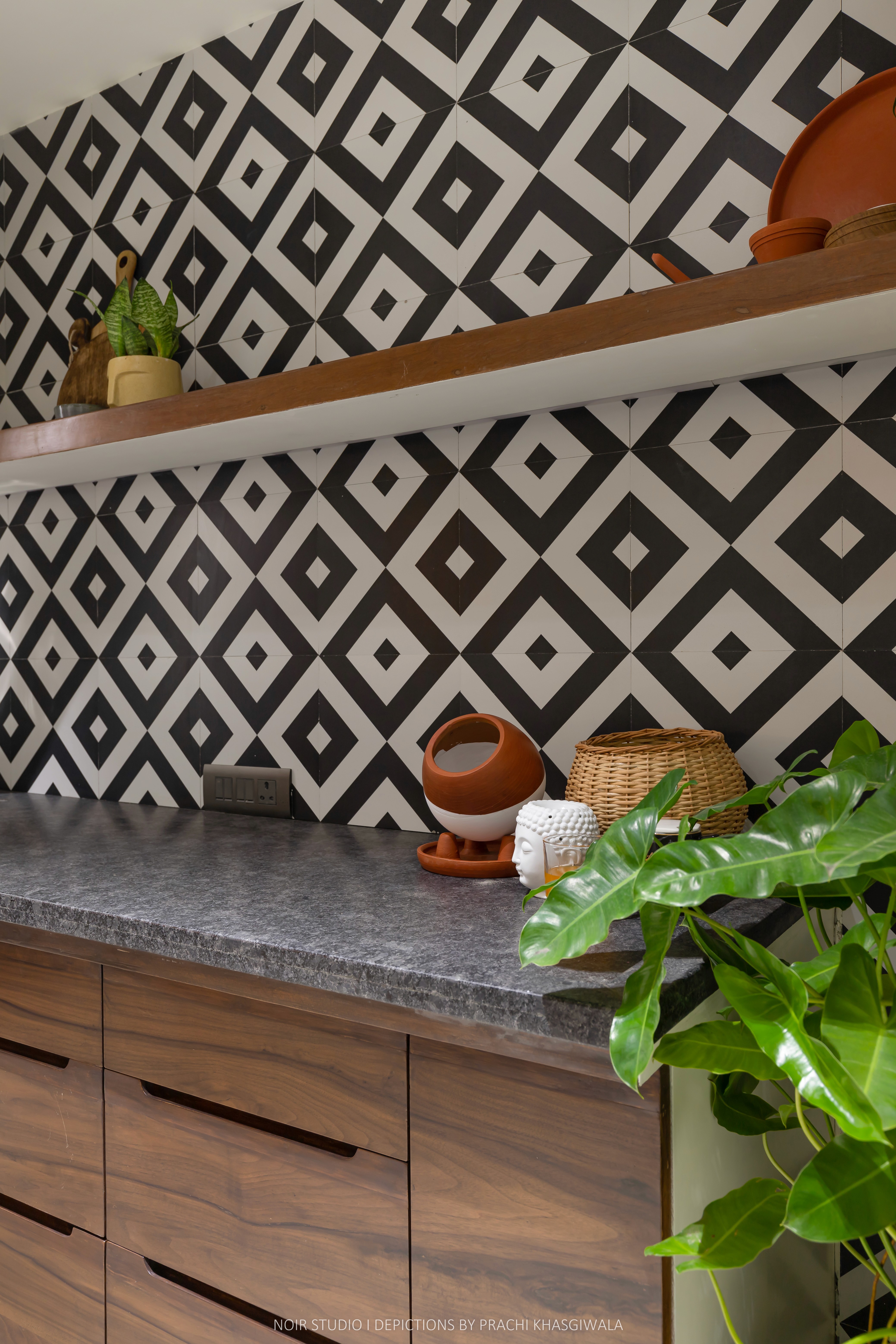 Black and white image of people working at a table with laptops, showing hands gesturing during discussion of digital content displayed on screens, with fabrica® logo in the corner.