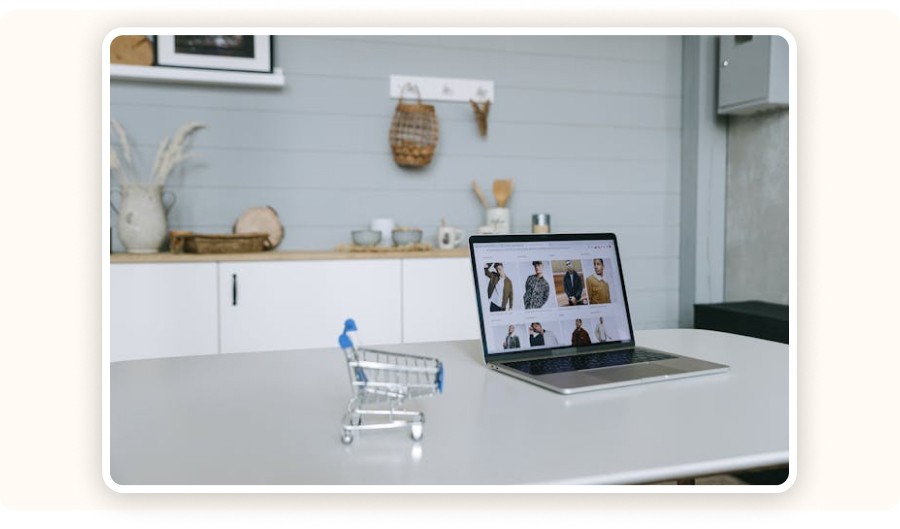 computer and miniature shopping cart