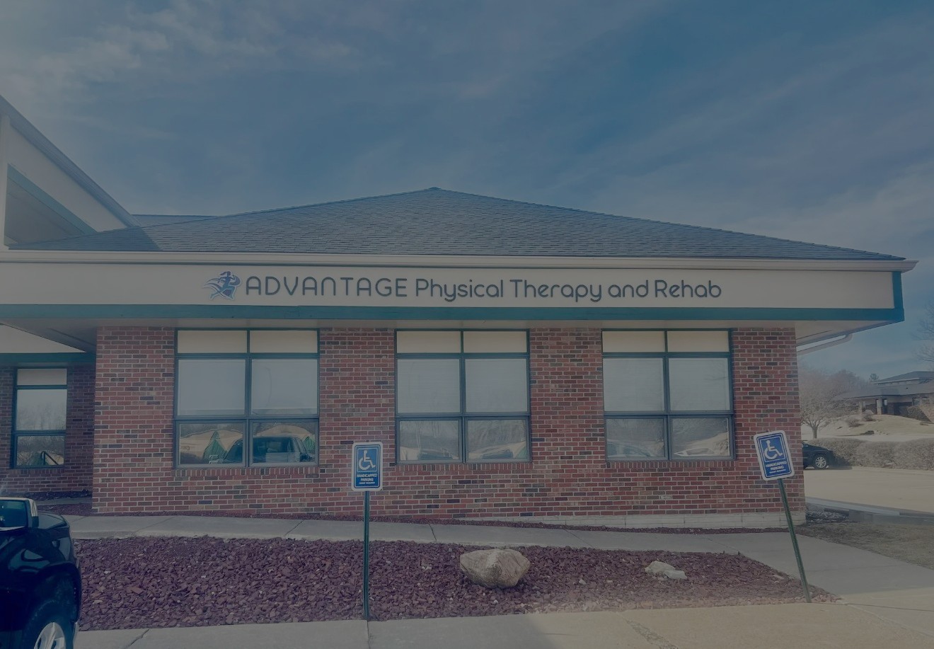 Front entrance of Advantage Physical Therapy and Rehab, a local rehabilitation clinic with accessible parking and professional facilities.