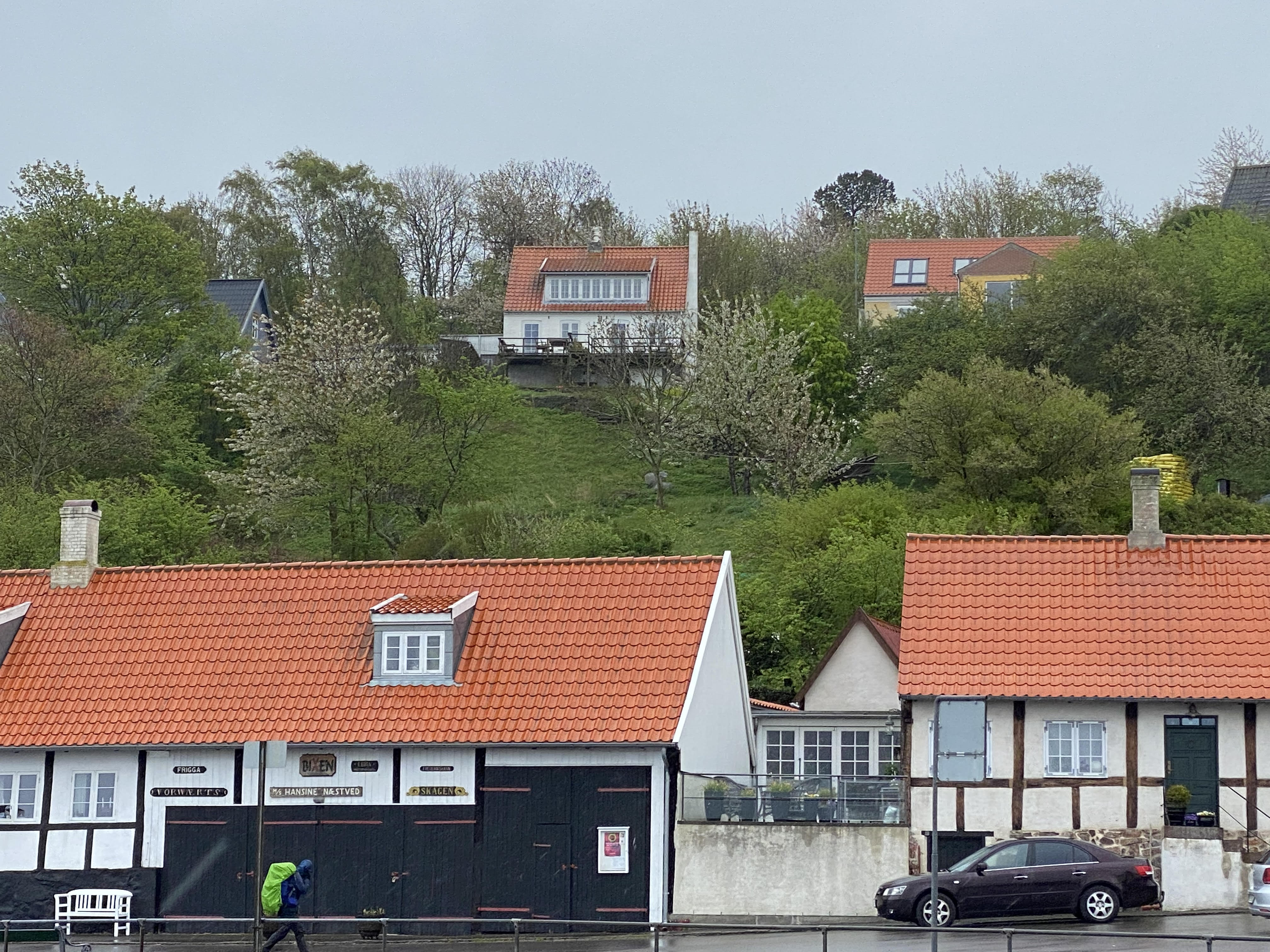round brown wooden table near window