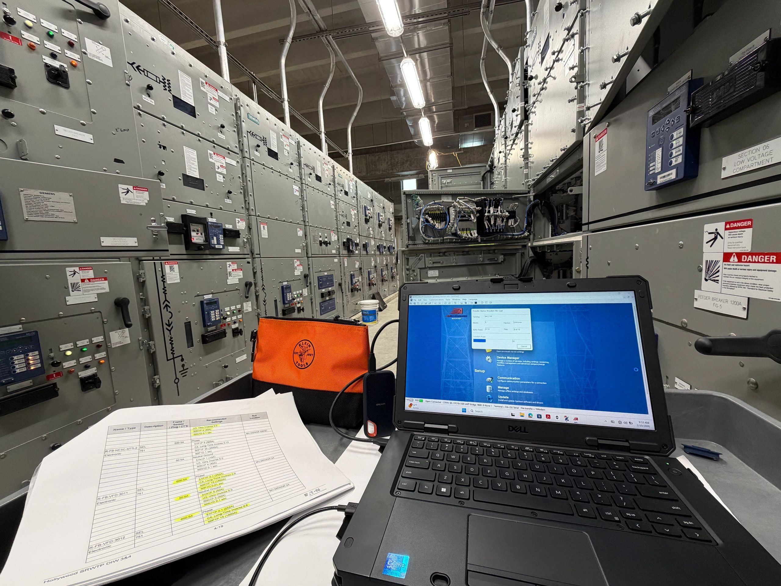Relay test software running on a laptop inside a switchgear room