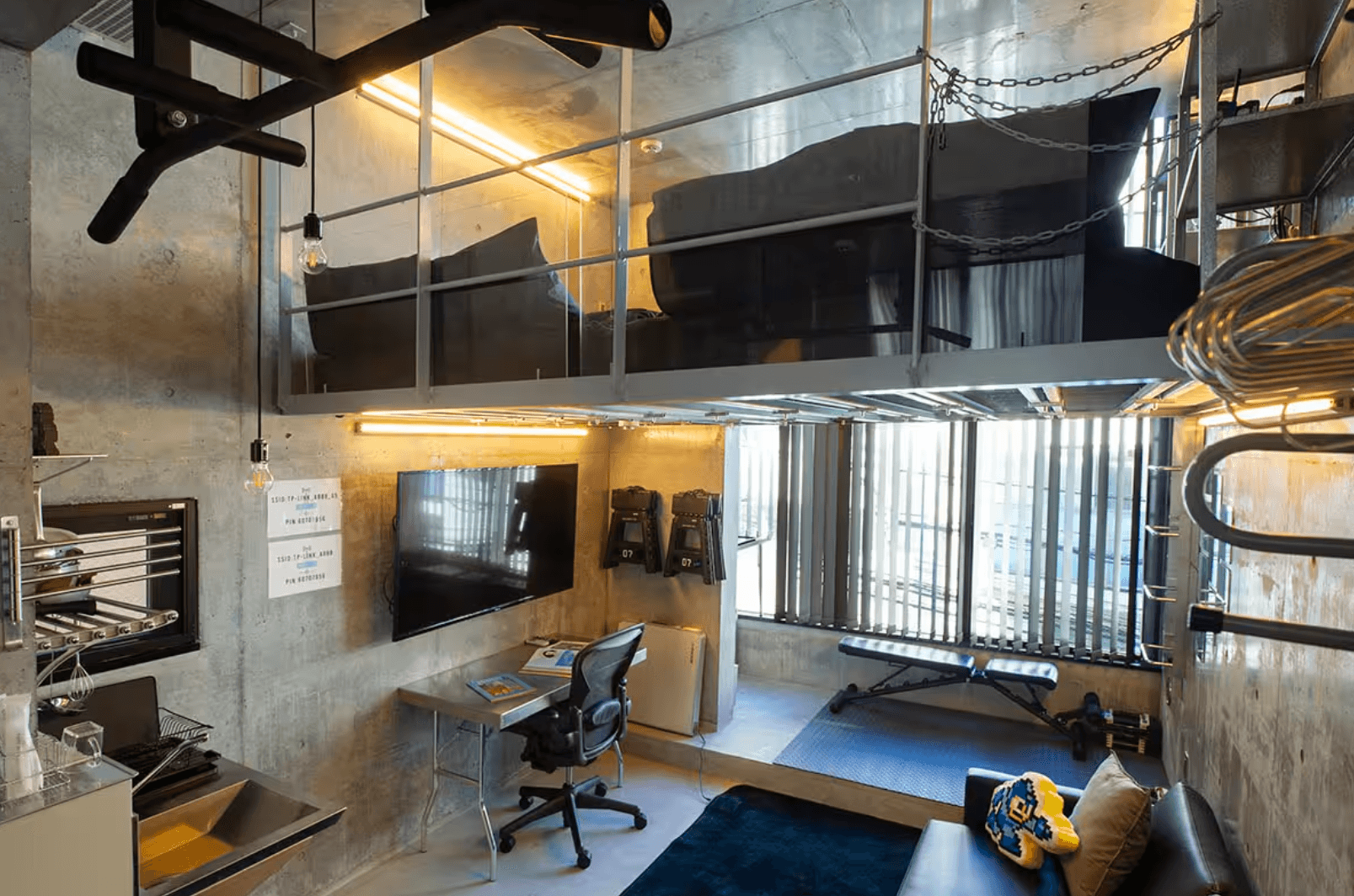 Tokyo loft featuring bunk-style beds and in home gym.