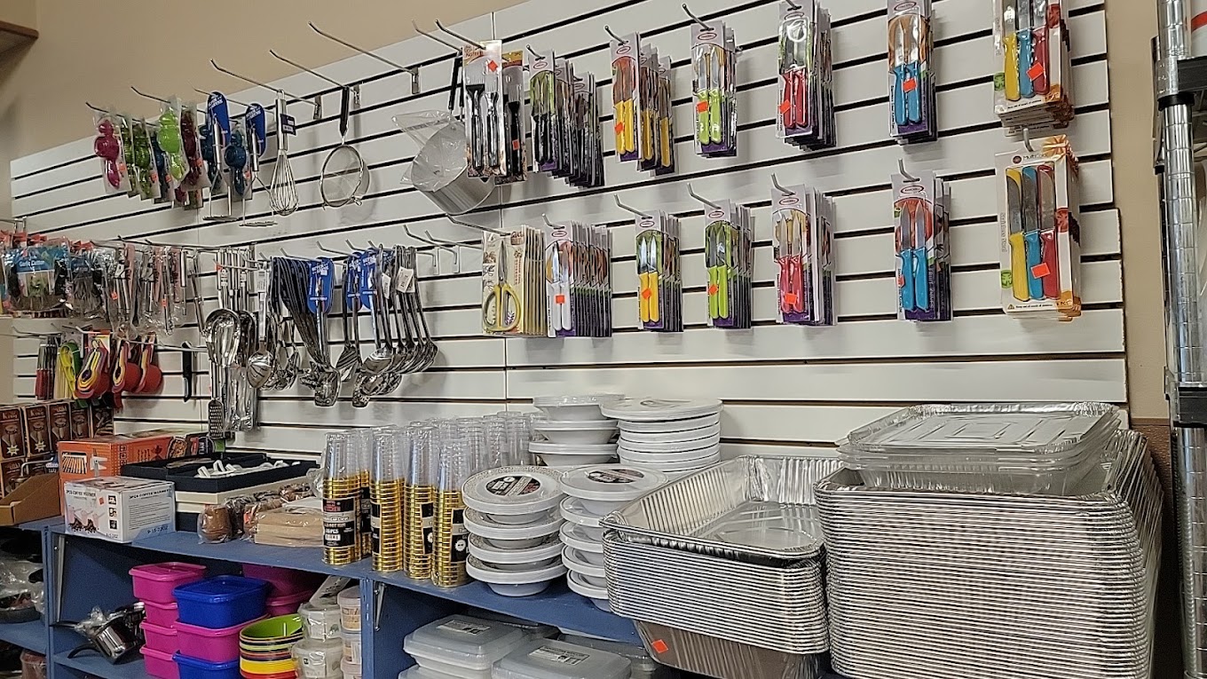 Kitchen and cooking utensils, including tongs, strainers, and aluminum trays available at International Food Market Orlando, your one-stop shop for ethnic cookware and supplies.