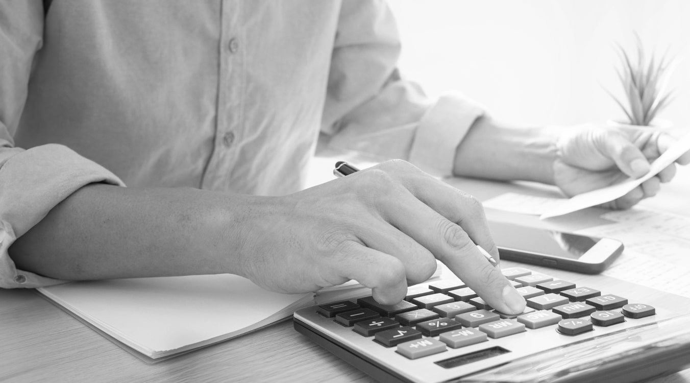 Dry cleaner owner doing the accounting work for his business