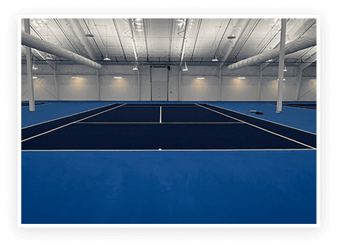 Blue indoor tennis courts at First Serve Tennis Center in South Sioux City, Nebraska