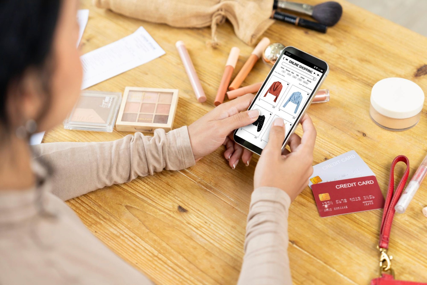  A woman using her smartphone to shop for cosmetics, showcasing modern online shopping habits.