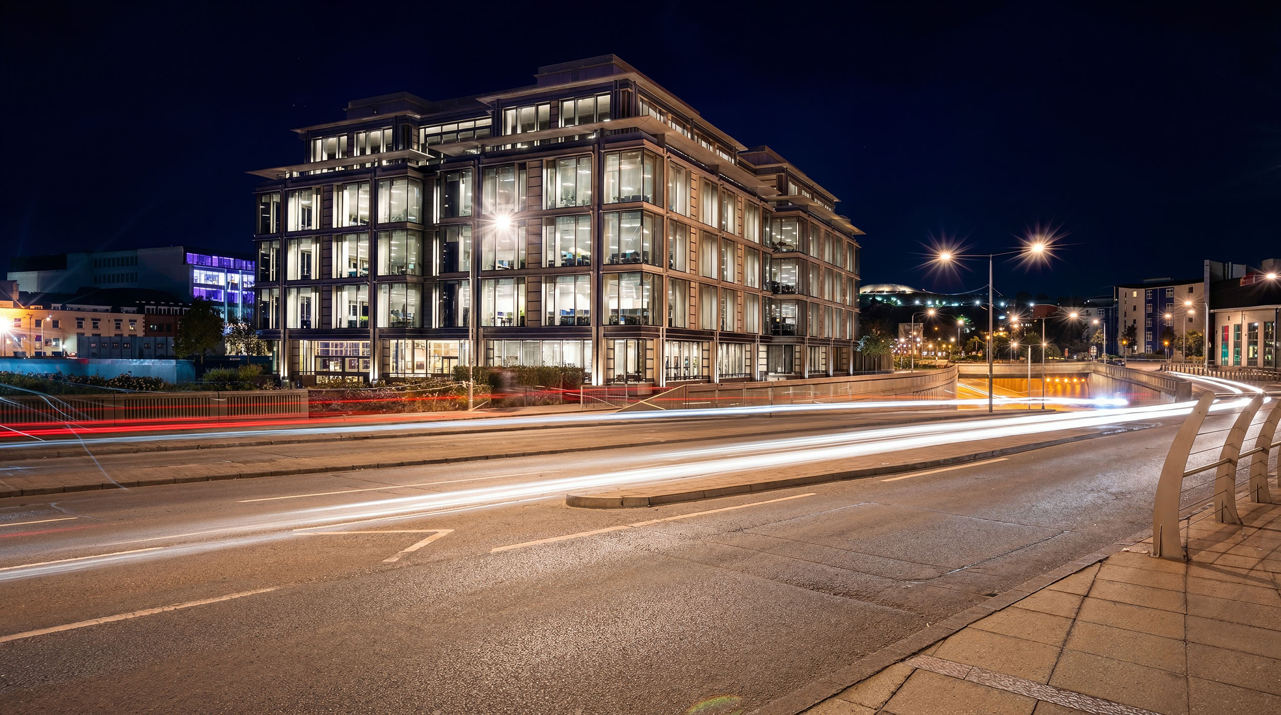 Nighttime architectural CGI of a modern building.