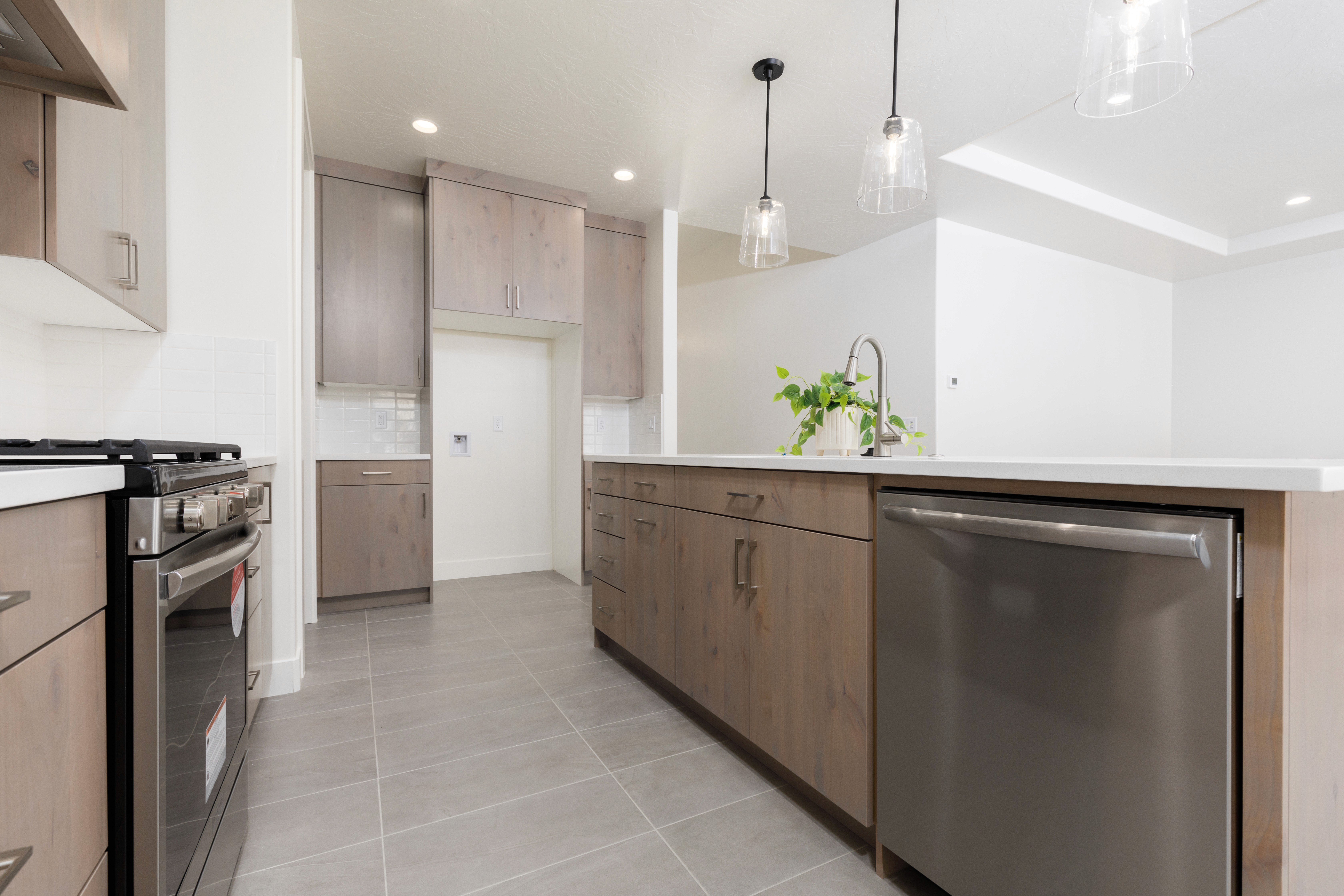 Close-up of wood kitchen cabinetry in a Hurricane, Utah home showcasing natural tones and clean hardware.