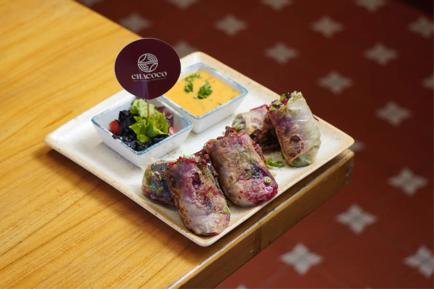 Rice Paper Rolls on a tray kept on a wooden table