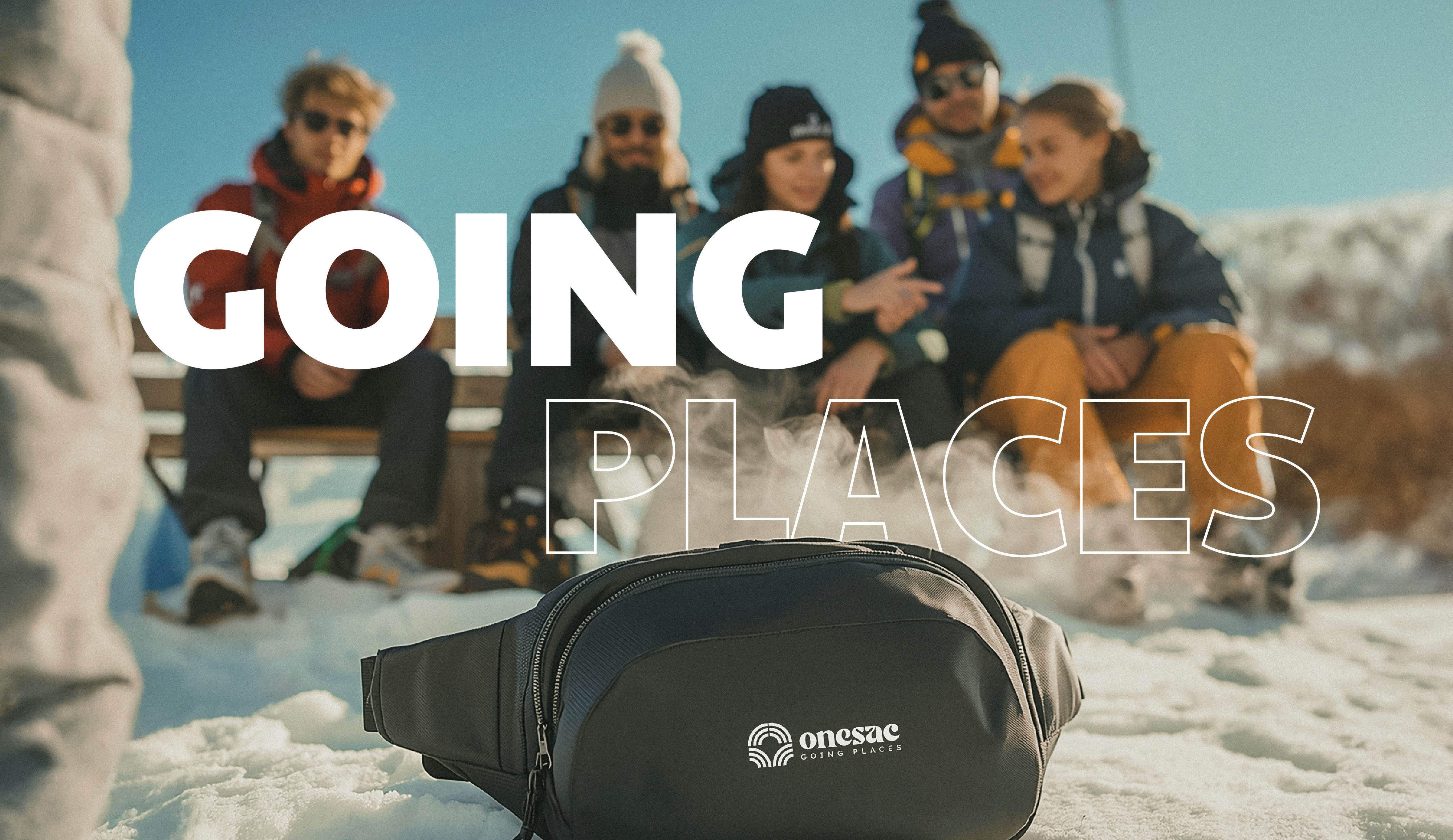 Modern sustainable townhomes surrounded by lush landscaping and a winding pathway.