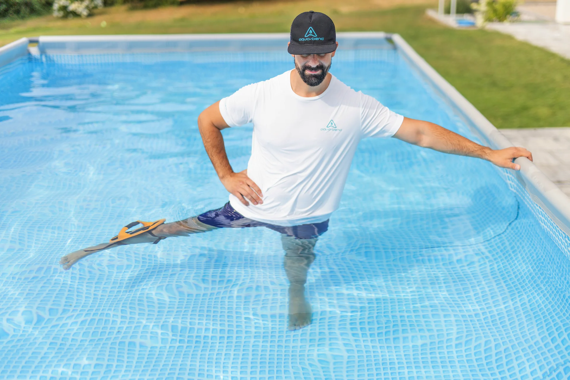 Man performing side leg raise in pool with Aqua-Bend Kinetic Edition disc strapped to the leg