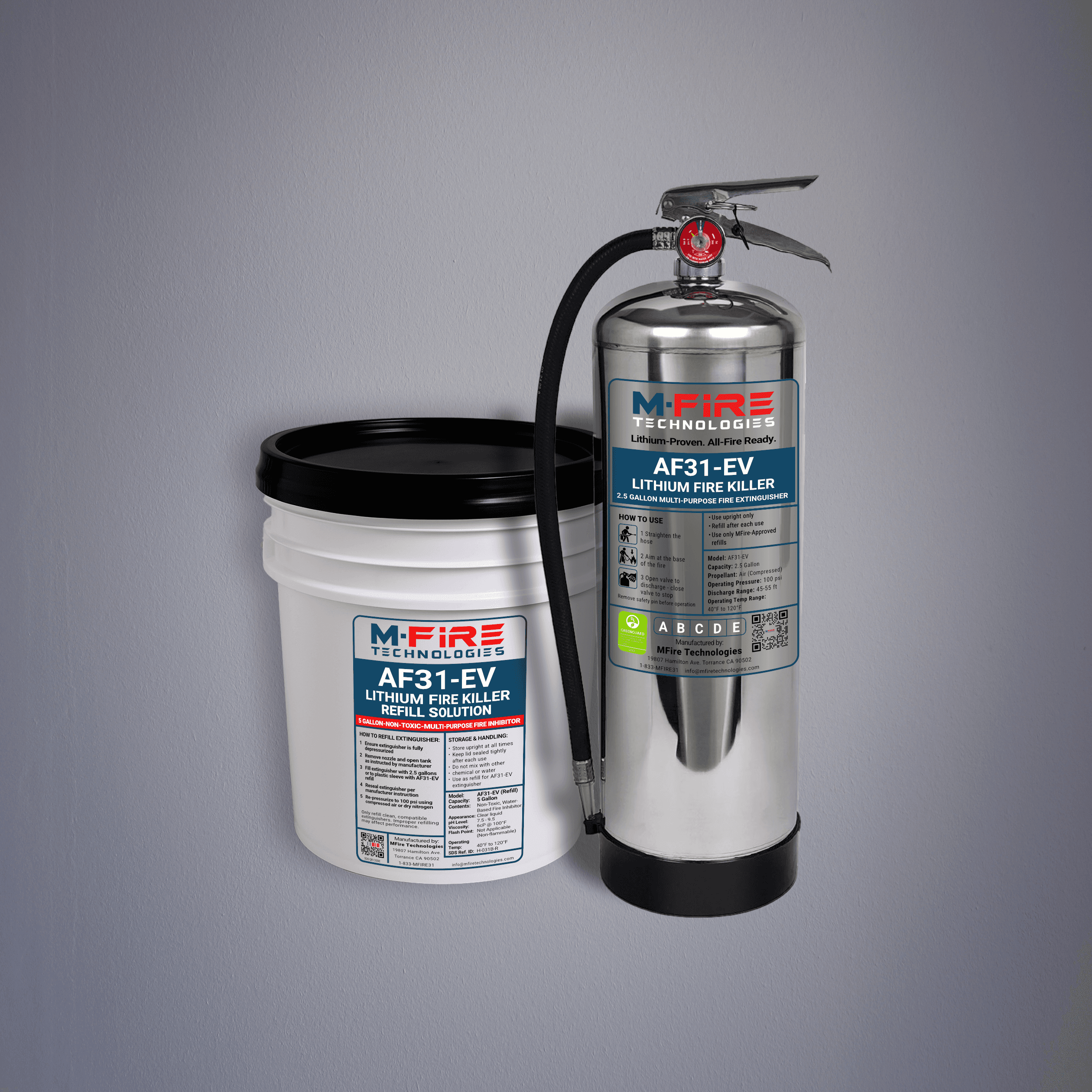 AF31-EV Lithium Fire Kit: a stainless steel fire extinguisher and a refill solution bucket, both labeled M-Fire Technologies AF31-EV Lithium Fire Killer