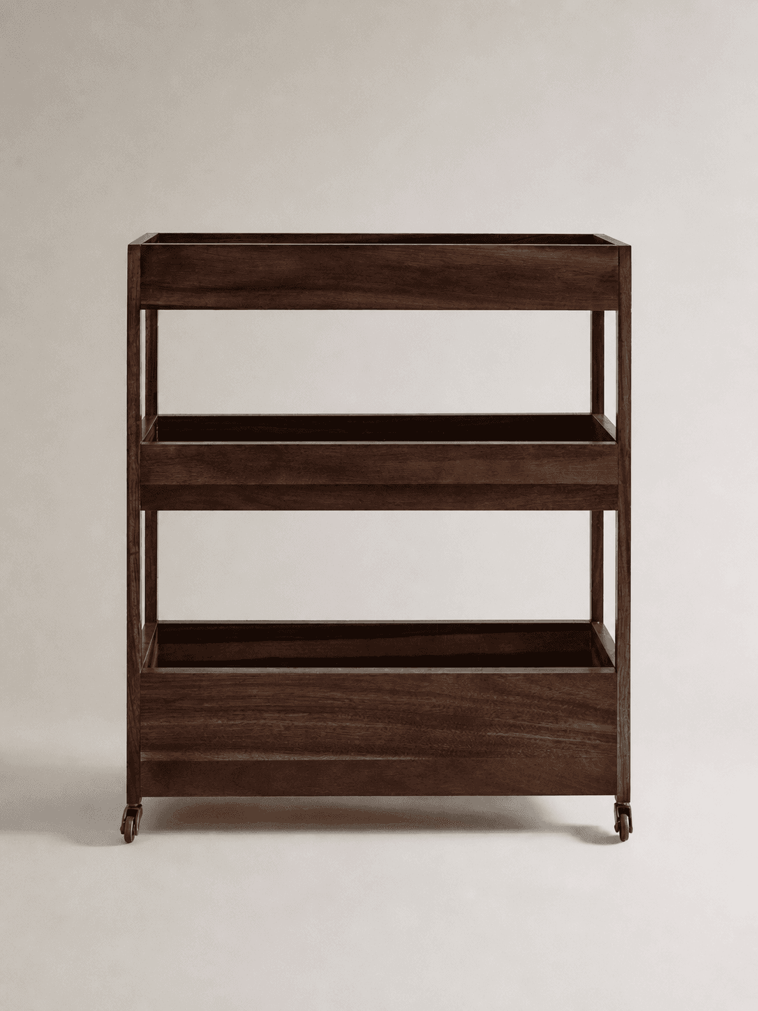 Minimalist wooden shelving cart on casters