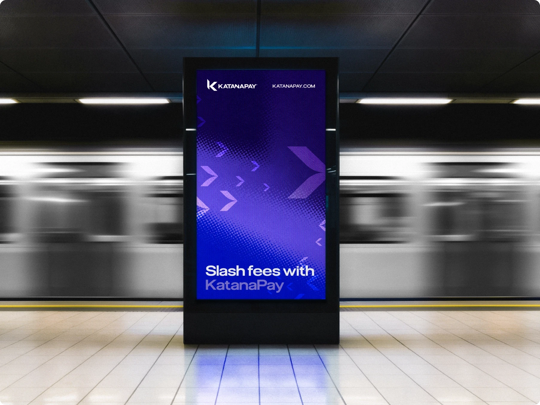 Purple KatanaPay digital ad in a subway station reads “Slash fees with KatanaPay,” with a blurred train rushing behind it.