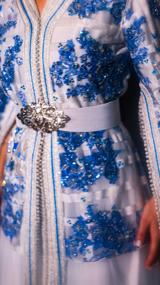 Light blue Moroccan bridal caftan with intricate hand embroidery, luxury handcrafted piece for weddings in Bahrain