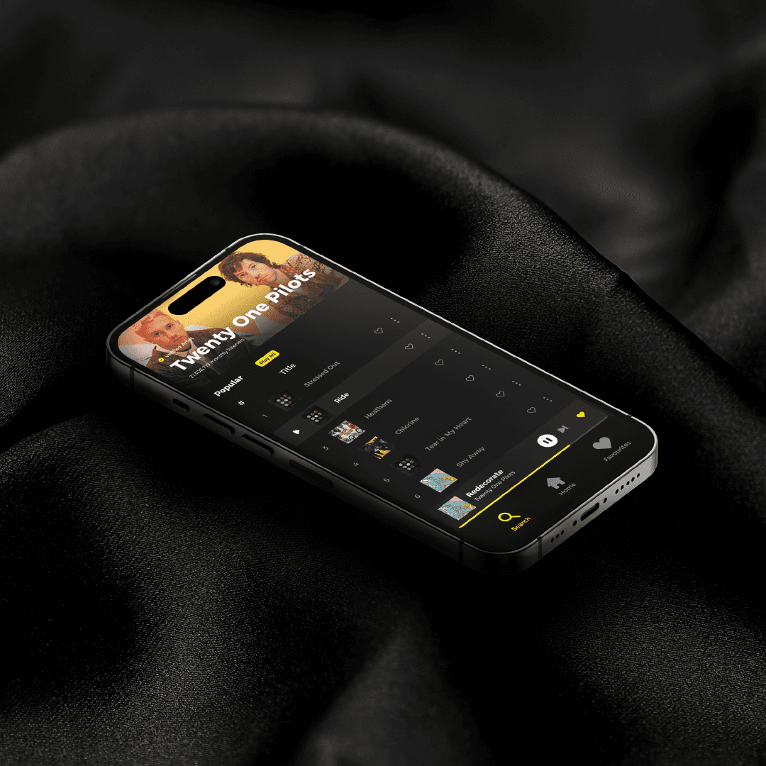 iPhone mockup showing a dark music app UI with a Twenty One Pilots artist page, on black fabric.