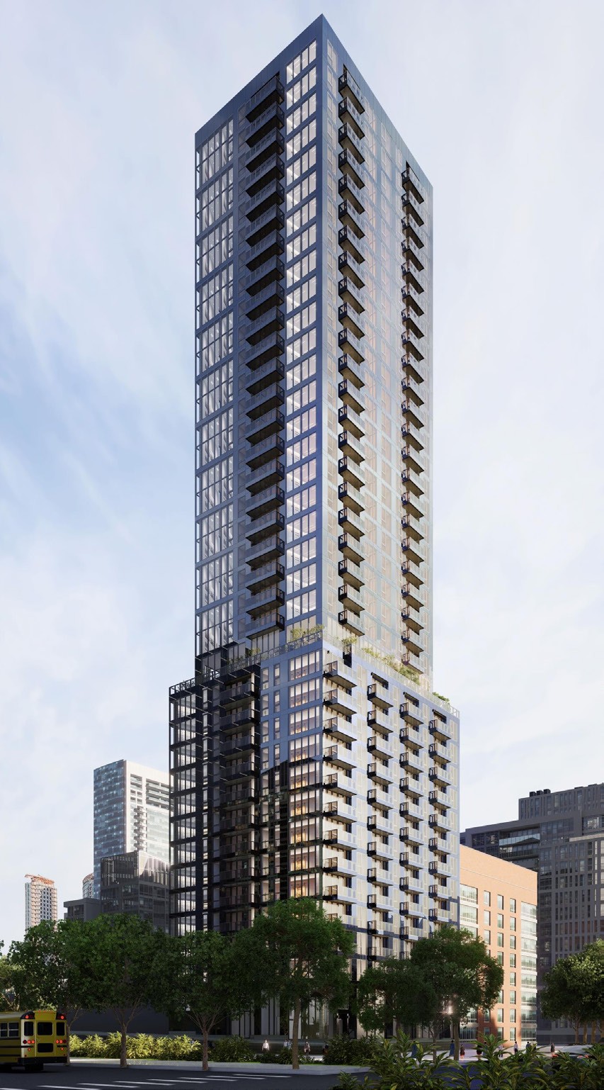 Tall modern skyscraper with vertical lines, viewed against a clear blue sky.