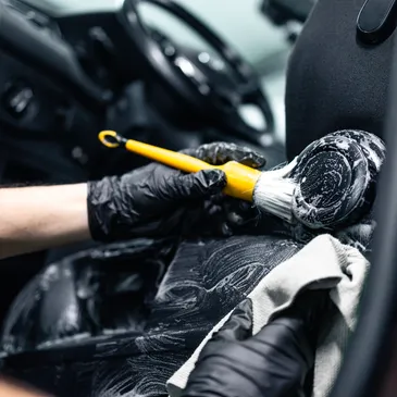 A team of pest controll experts carrying fog machine in an office