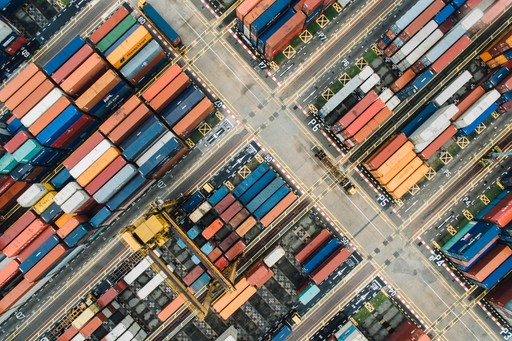 Aerial view of a shipping container port, illustrating international moving logistics from the US to France