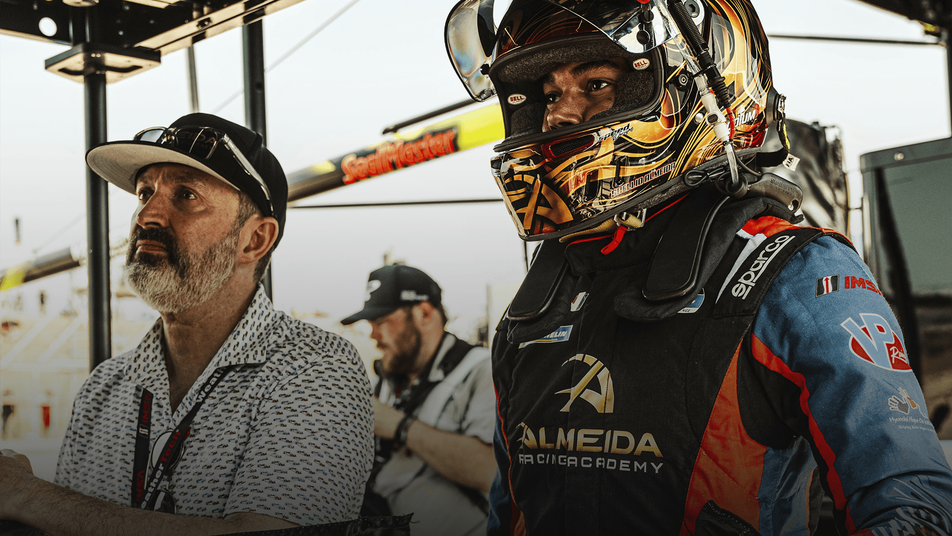 Suellio Almeida. IMSA Driver, North America Radical Racecar Champion, Founder of Almeida Racing Academy. Standing next to Greg Hoobler. 