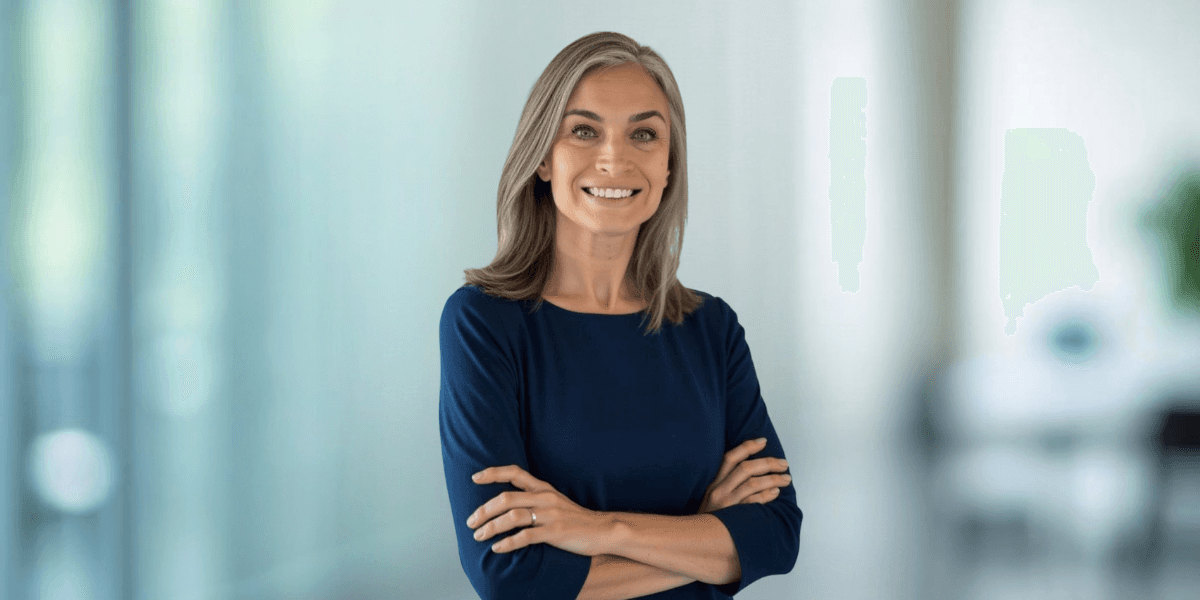 Dr. Dorota Novitskie, forensic psychologist, standing confidently with arms crossed in a professional setting, reflecting empathy and accountability in her work.