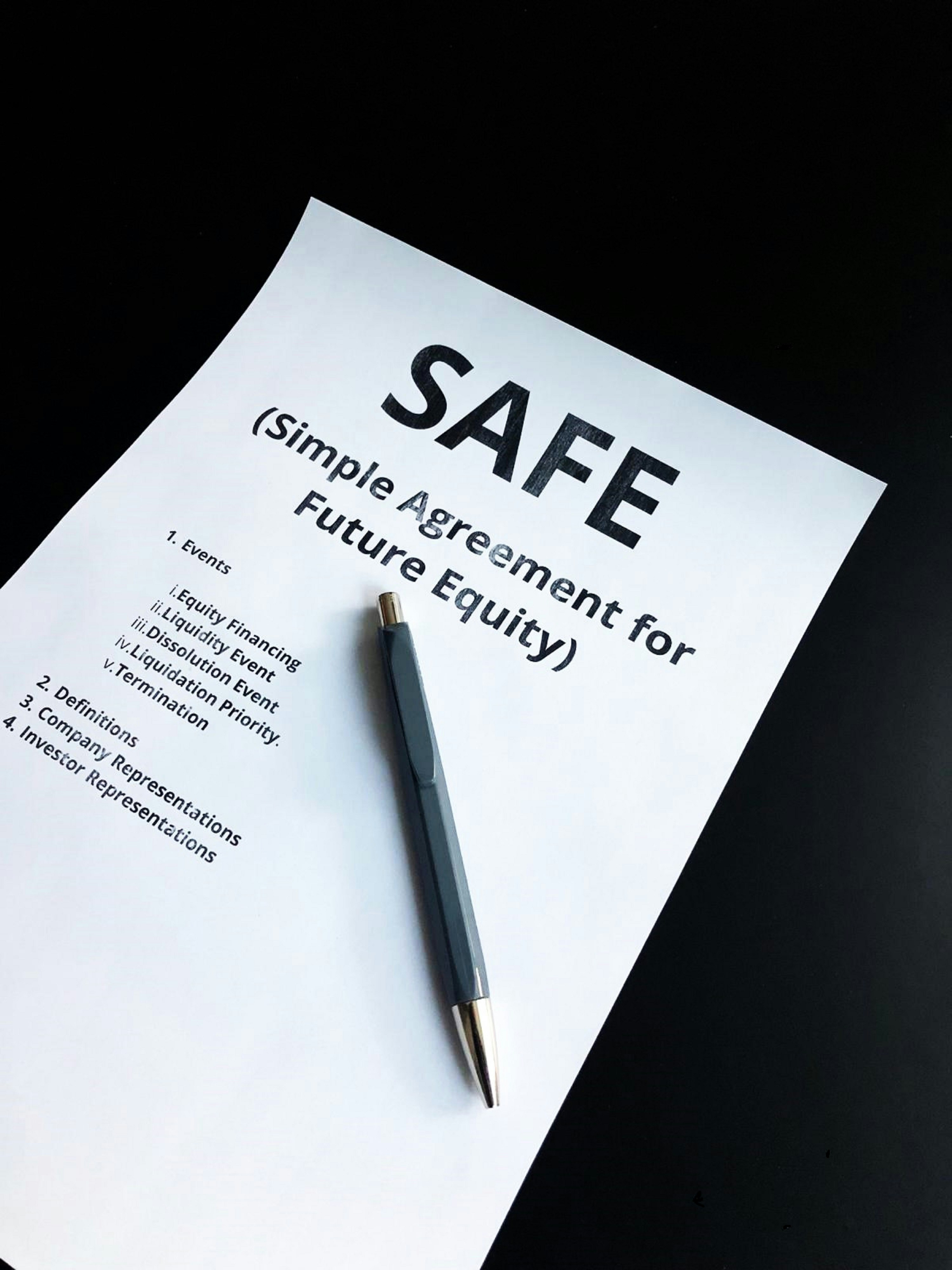 a pen sitting on top of a piece of paper