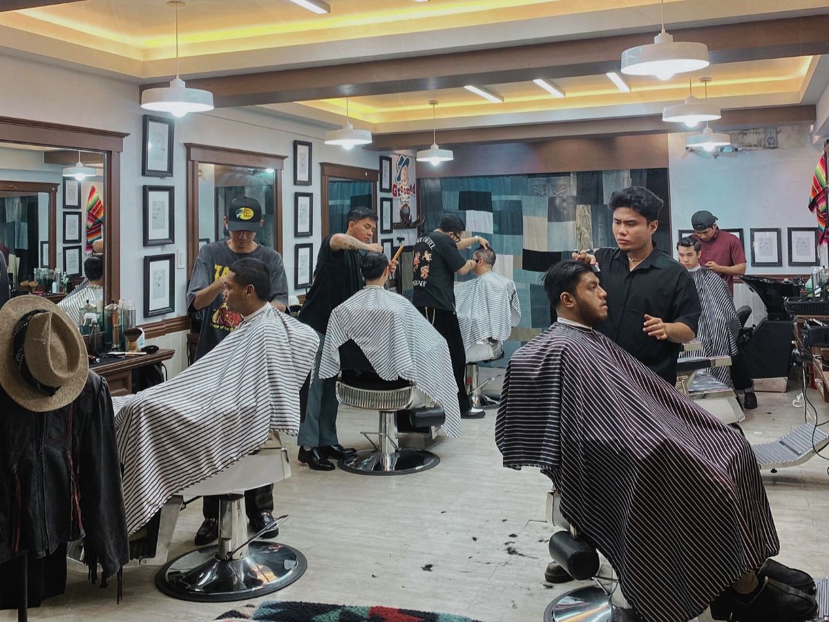 Pomade Cartel Barbershop in action