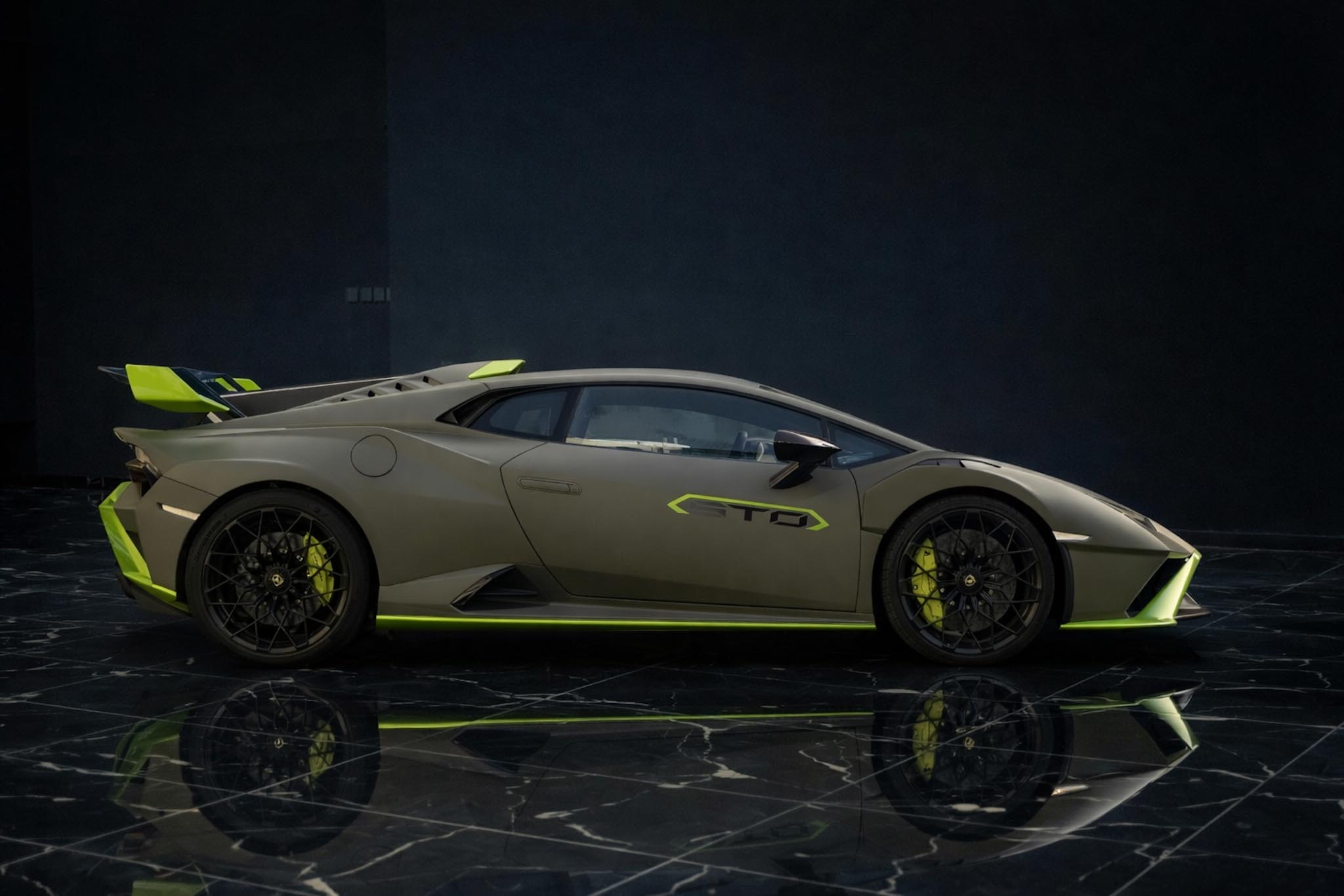 Lamborghini Huracán STO 2022 green side profile exterior by Queen of Supercar Rental Dubai
