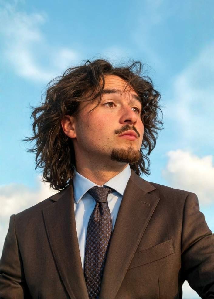 Woman with windblown short hair.