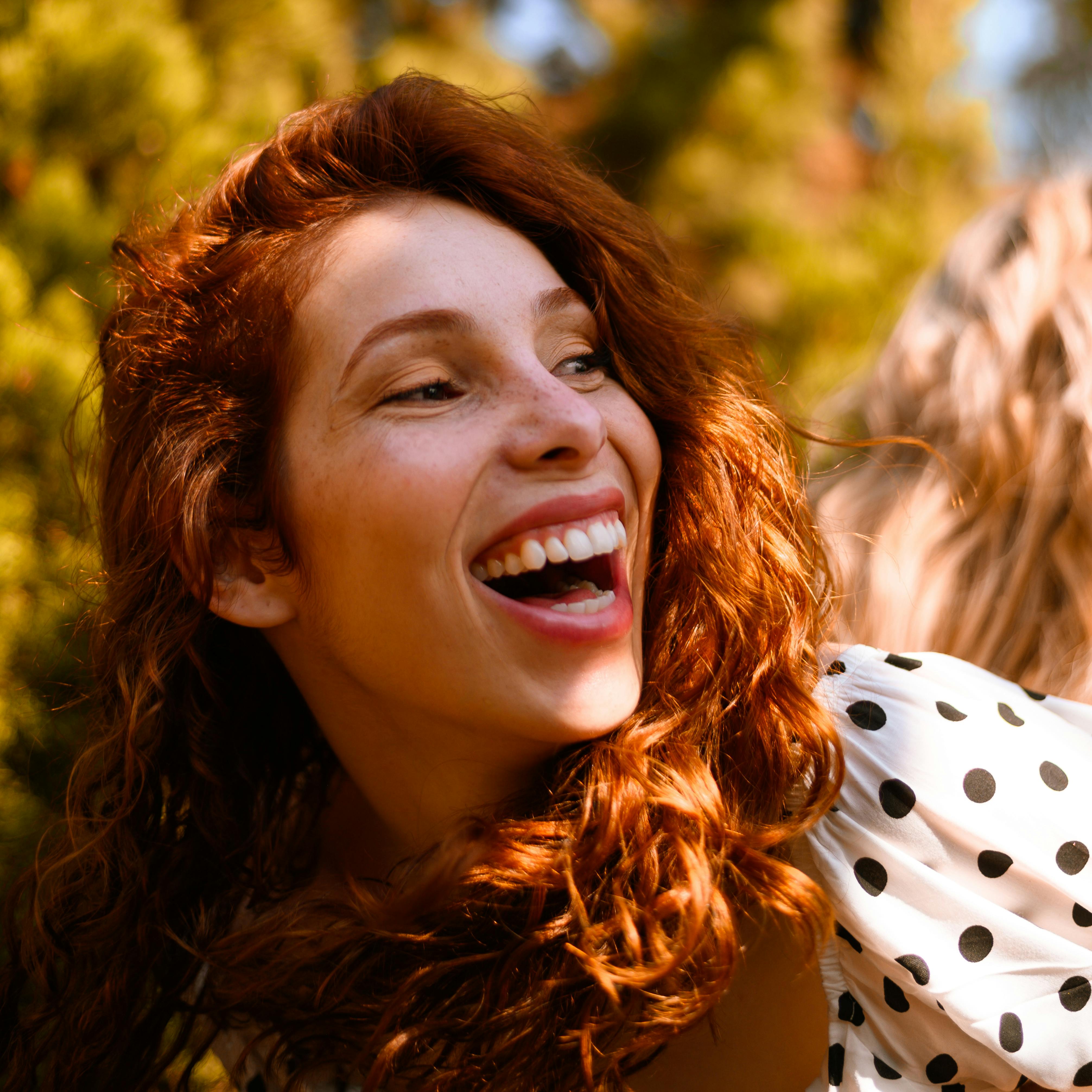 A red-haired girl smiles