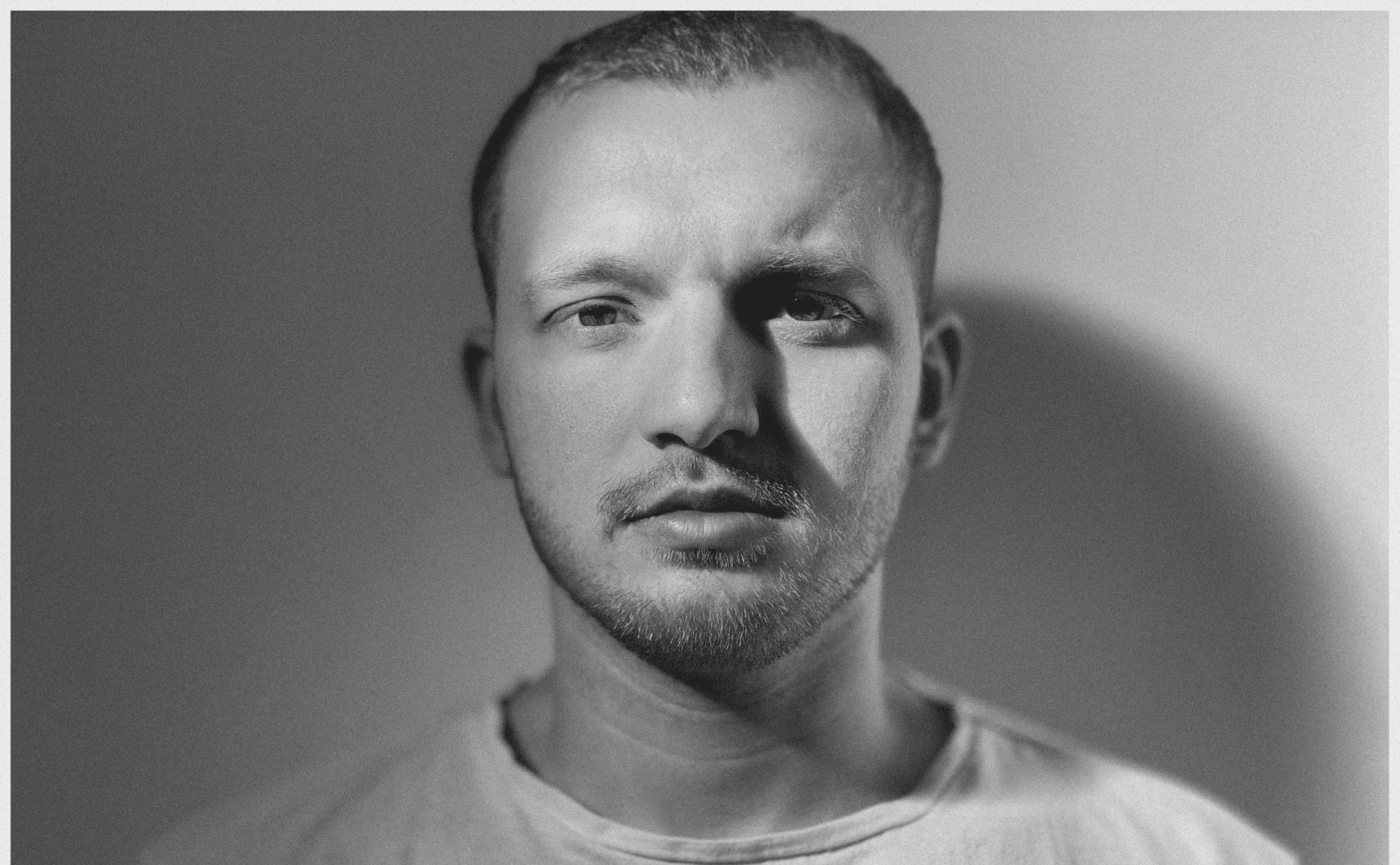 grayscale photo of woman wearing necklace and top