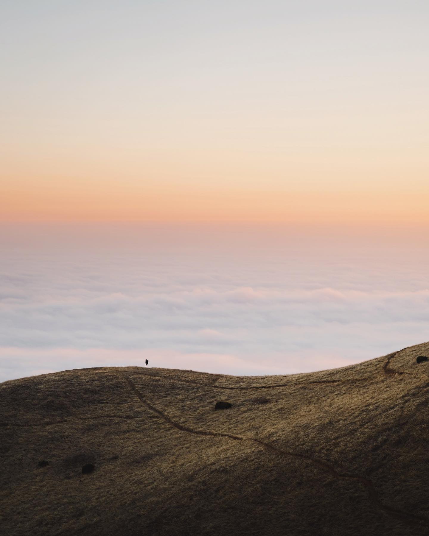 The sun setting behind the hills of Mount Tamalpais with vibrant sky colors.
