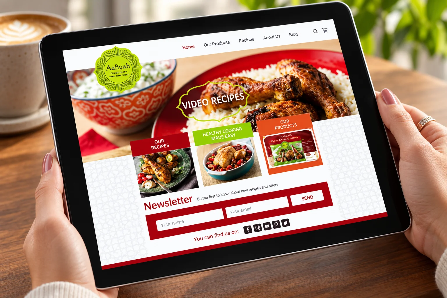 Person viewing Aafiyah food website on tablet displaying video recipes and products, highlighting digital marketing strategy