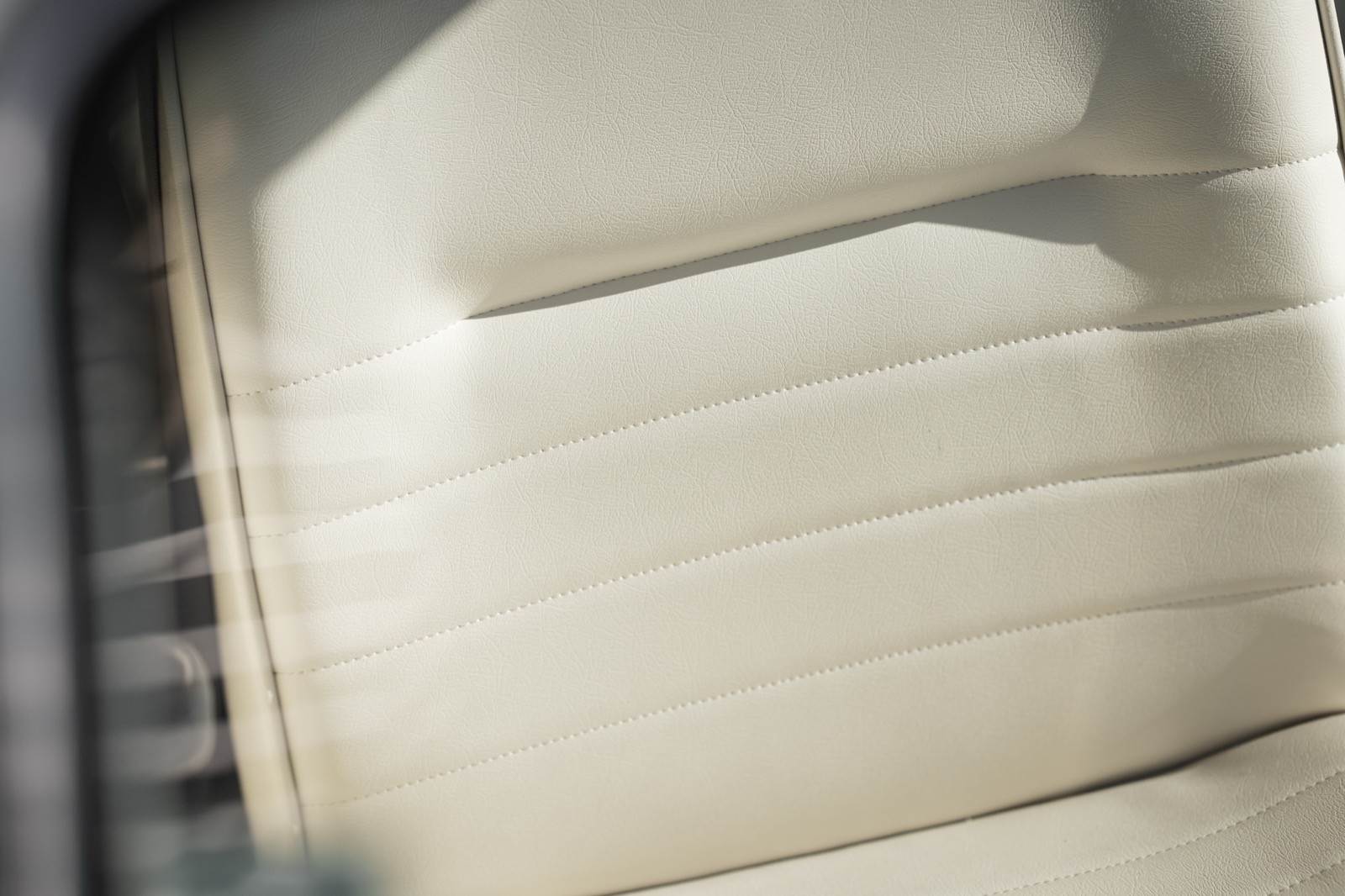 Close-up of a textured surface with vertical lines, creating a minimalist and modern aesthetic.