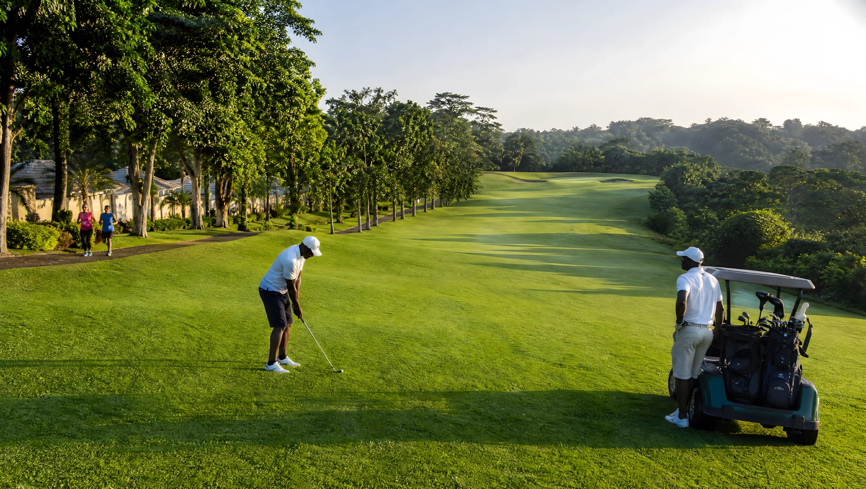 	Rendered golf fairway at sunrise with two players and a cart, bordered by mature trees and tropical forest