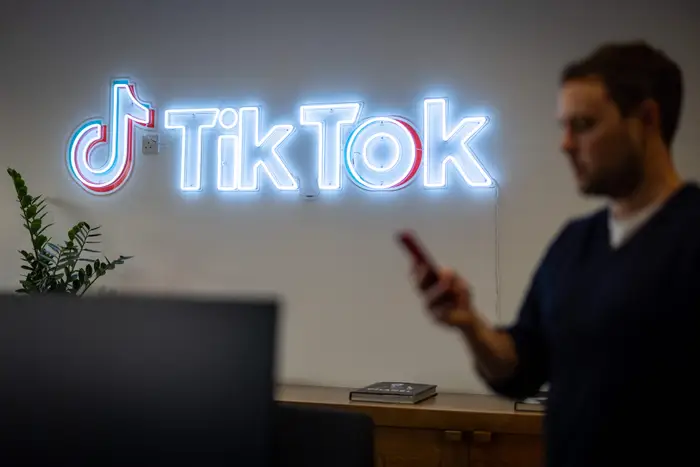 TikTok branding inside an office space, representing the platform where sellers connect with creators to build scalable TikTok Shop revenue.