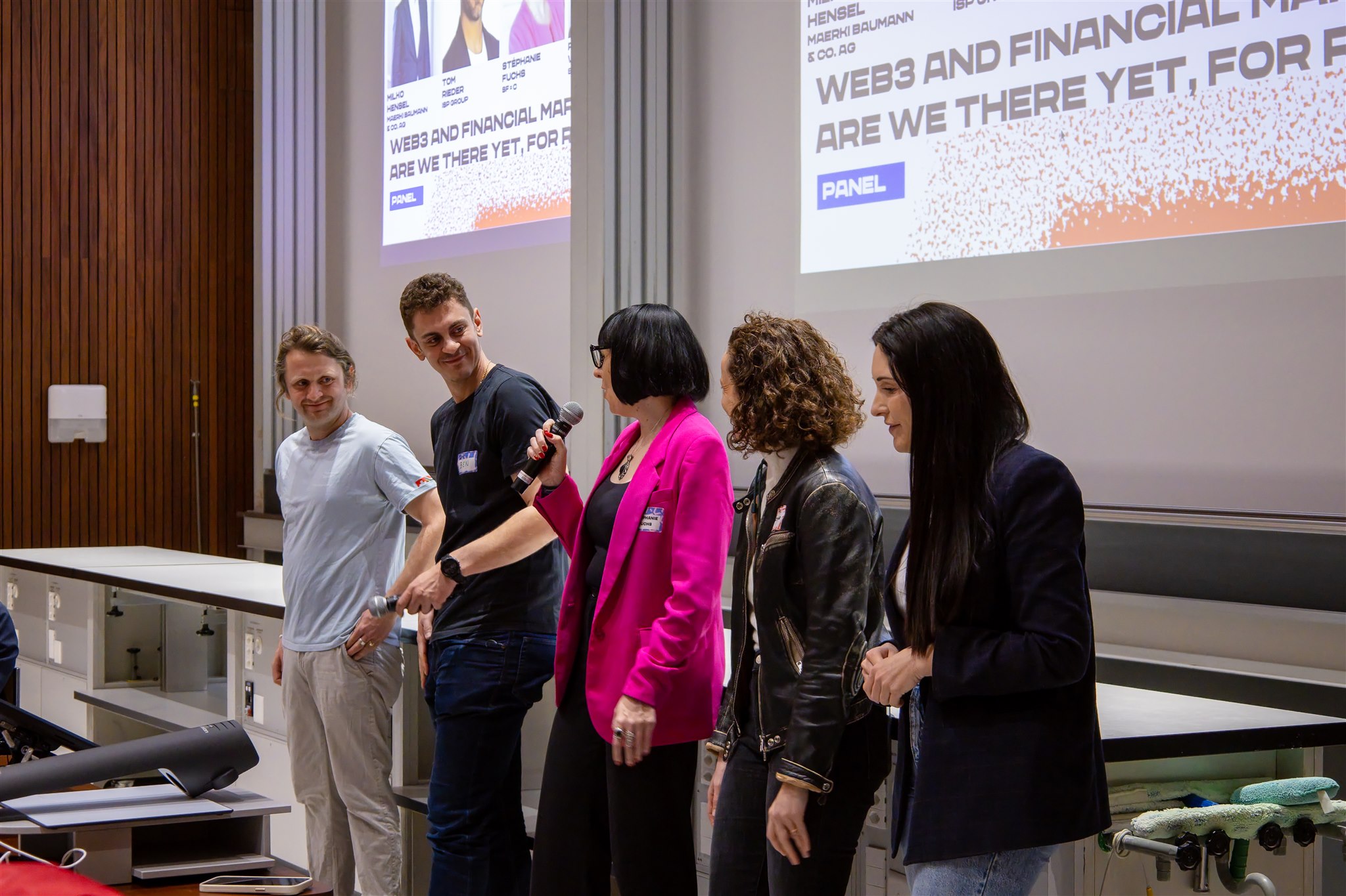 Panel speakers on stage during EthereumZüri conference at University of Zuricheakers on stage during EthereumZüri conference at University of Zurich