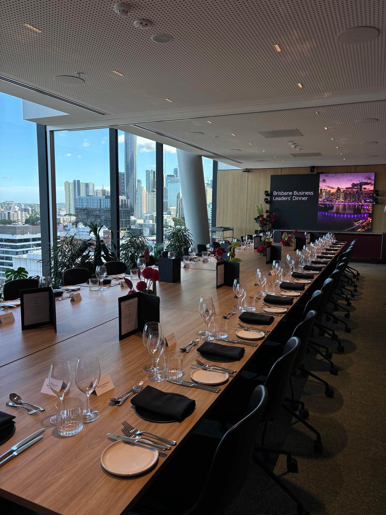 Boardroom table set up for sit-down dining