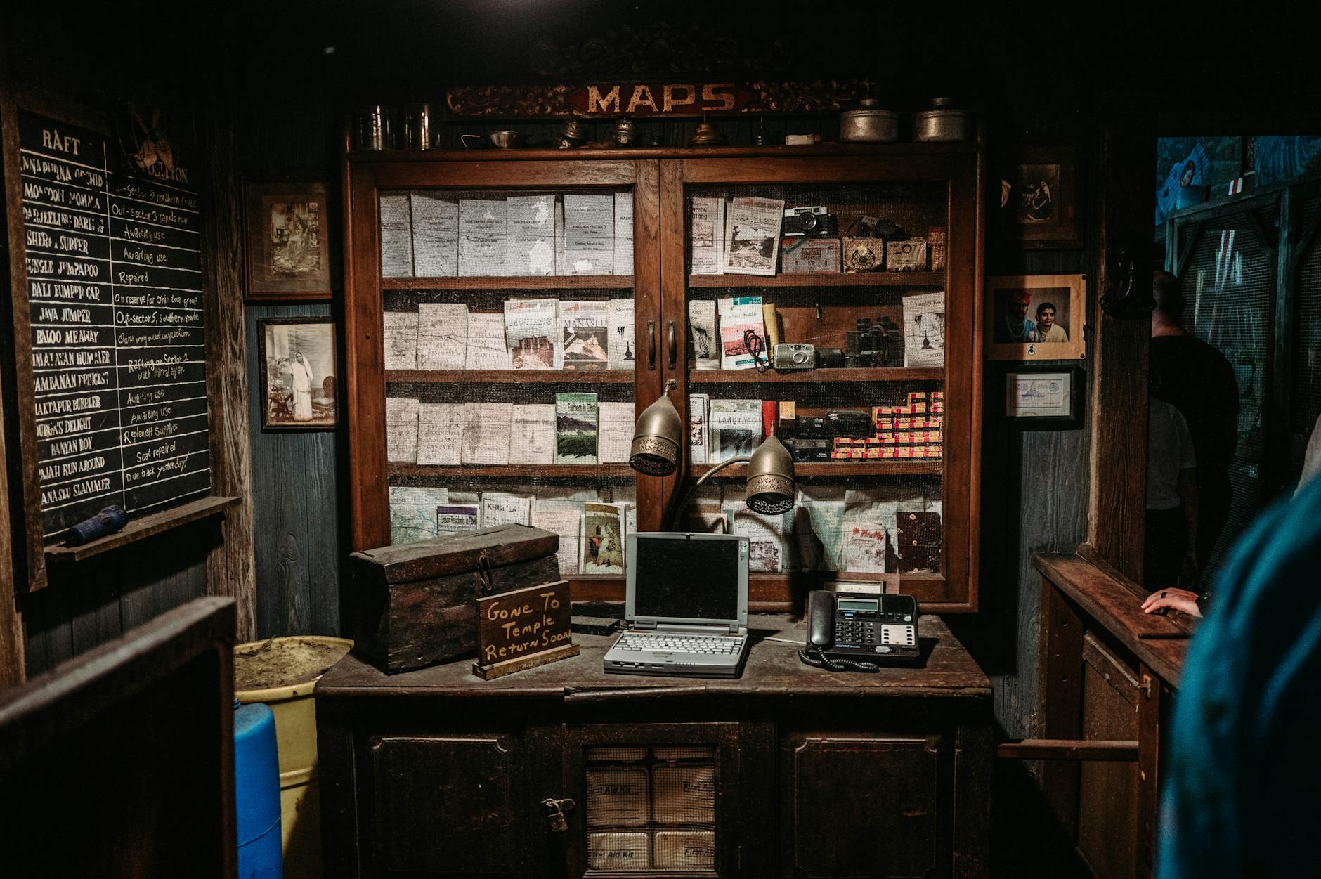 A vintage chalk blackboard next to a modern interactive flat panel showing the history of classroom technology.