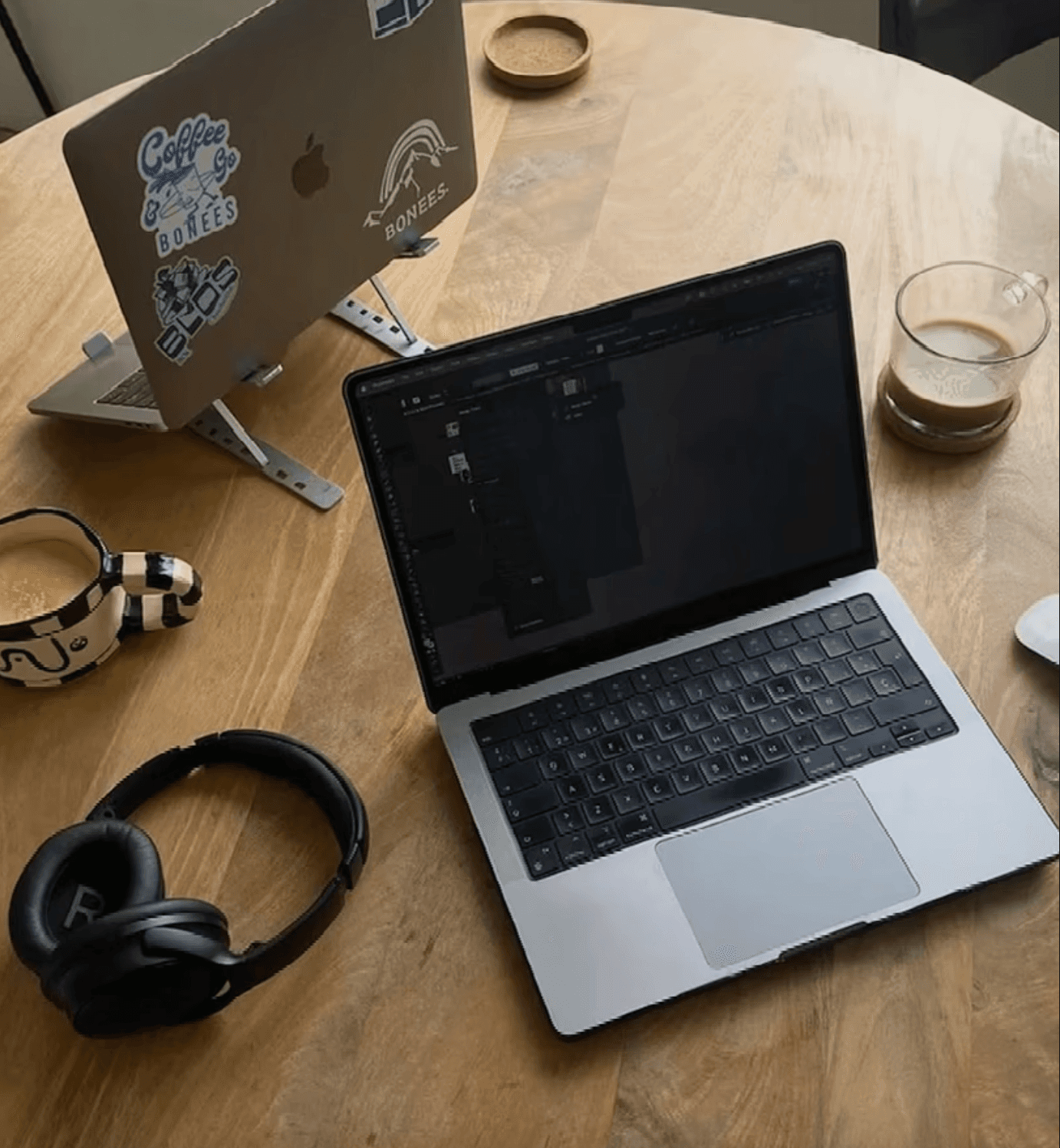 A thoughtful young person with dark hair gazes to the side, captured in soft black and white lighting.