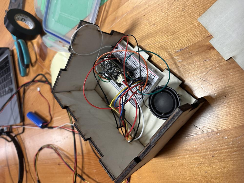 A pink object is in the air on a purple background