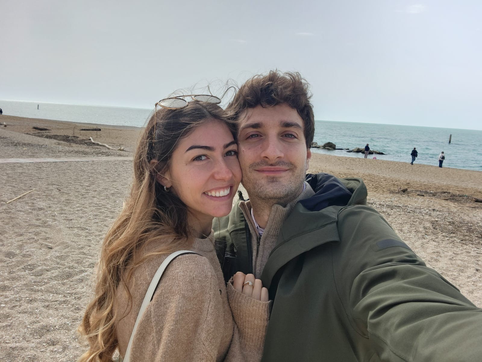 Couple portrait with dog on field