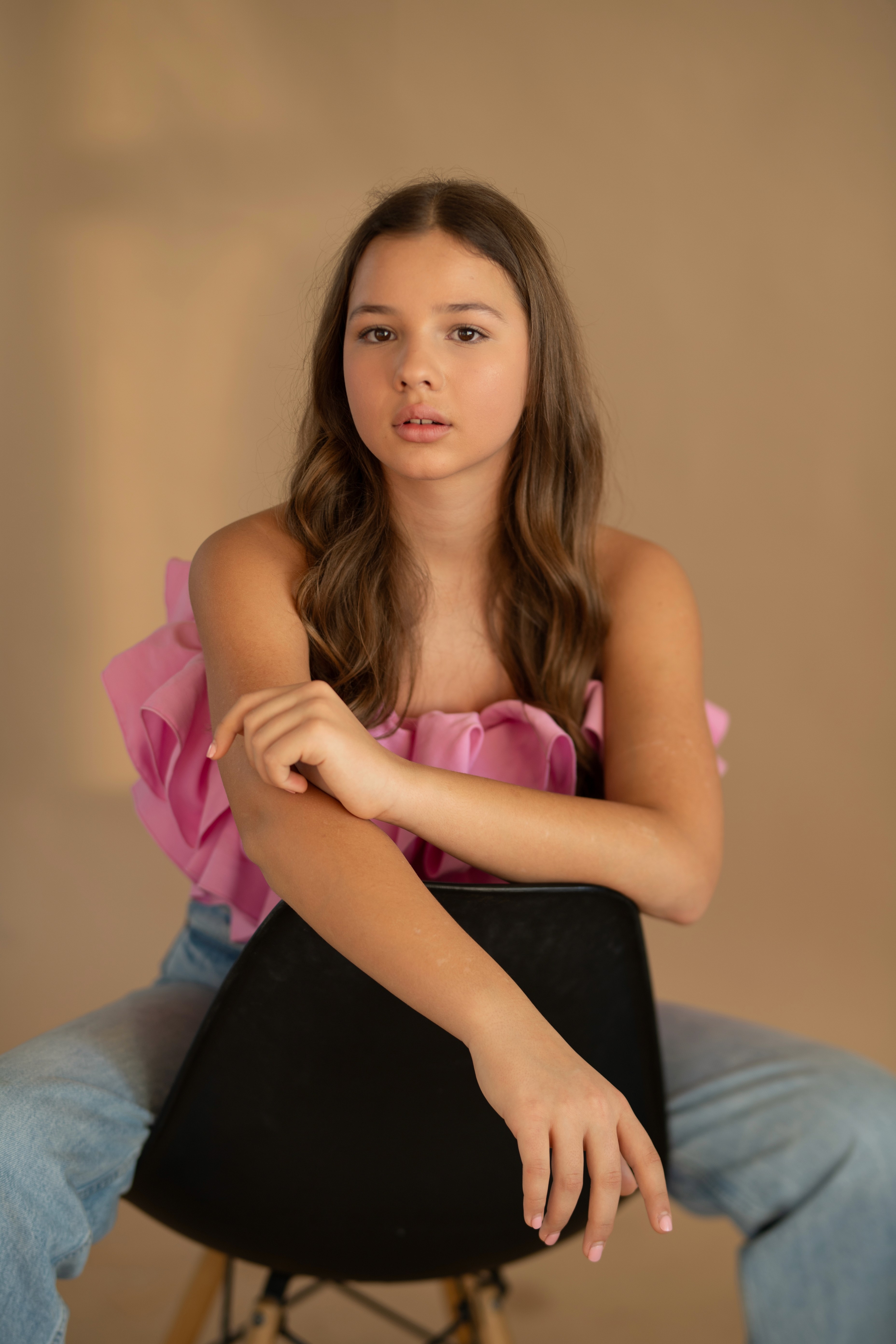 A gray and white kitten looks up attentively.