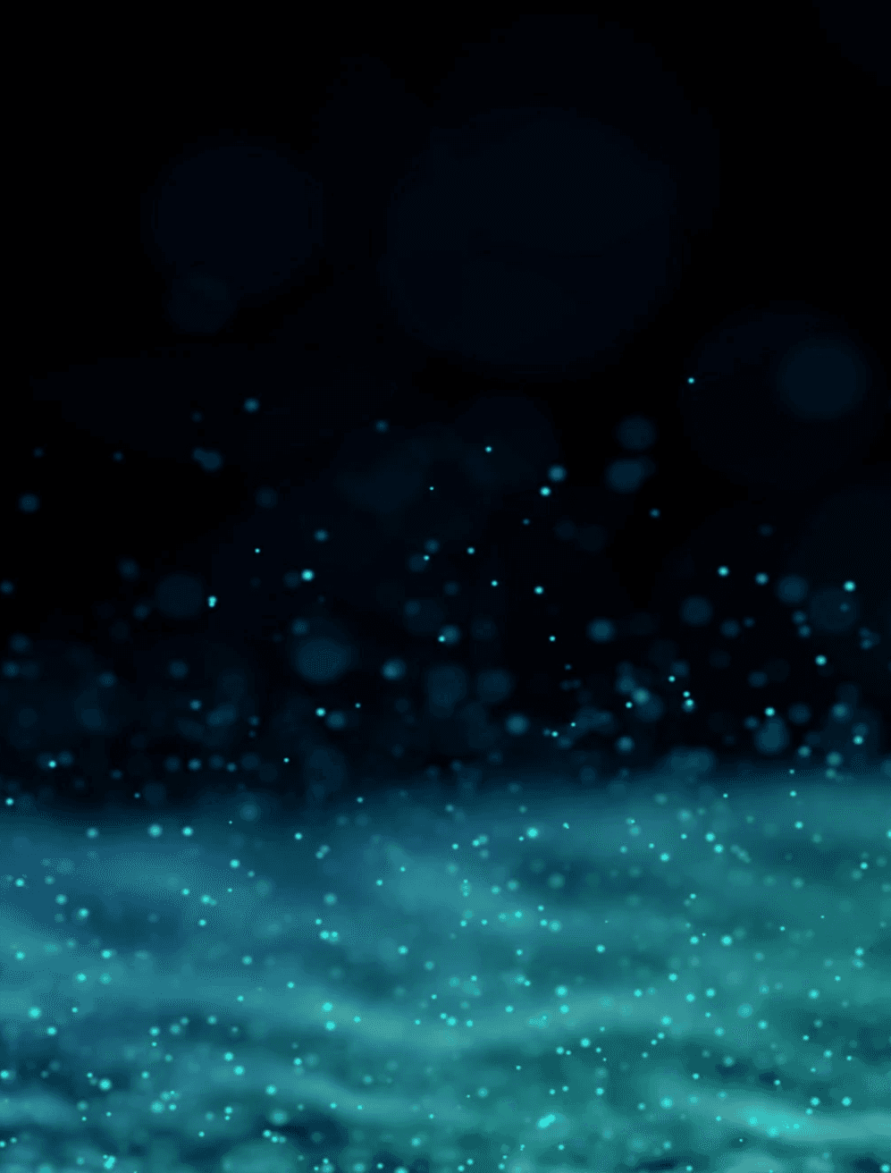 Close-up portrait of a person wearing a gray insulated hooded jacket with the hood up, showing their face framed by the hood against a light background.