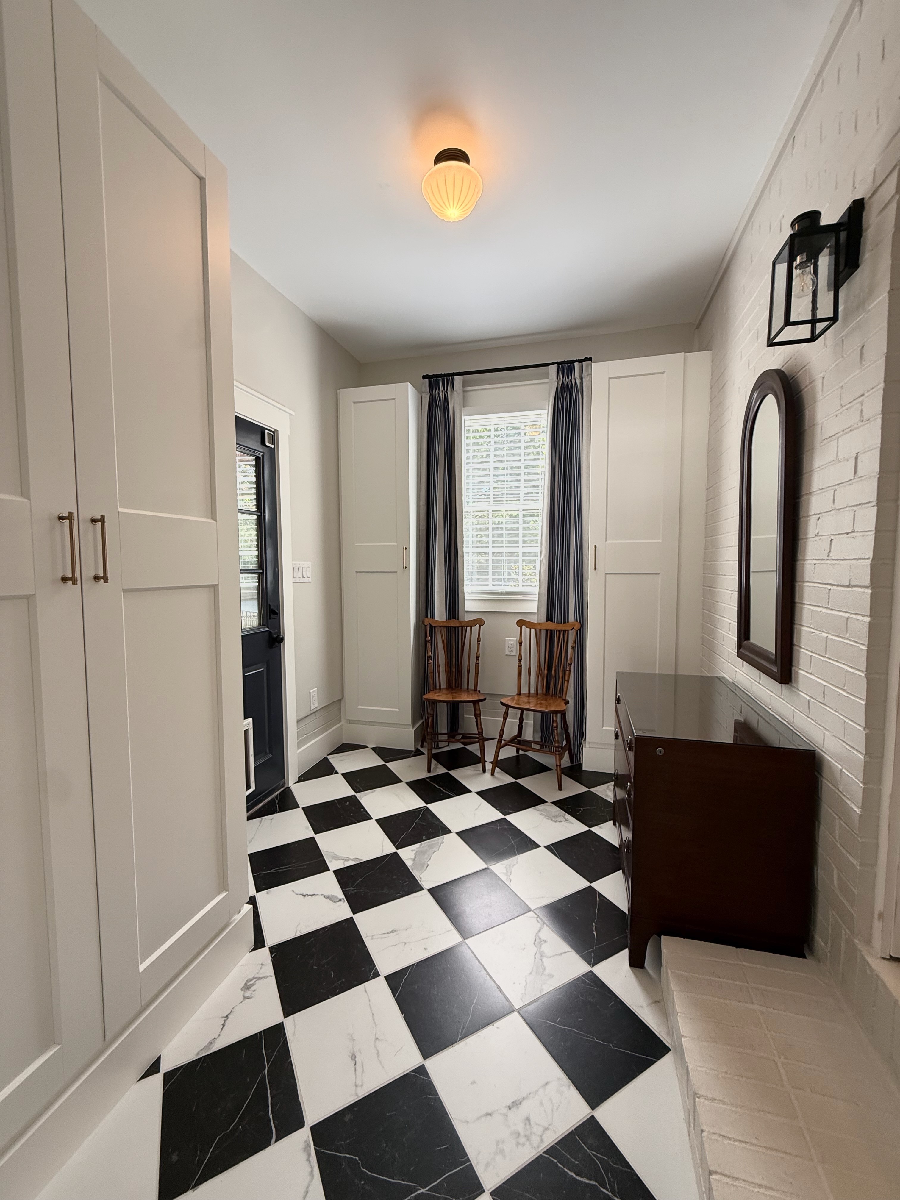 Home addition with black-and-white checkered floor tile in Ballantyne, NC.