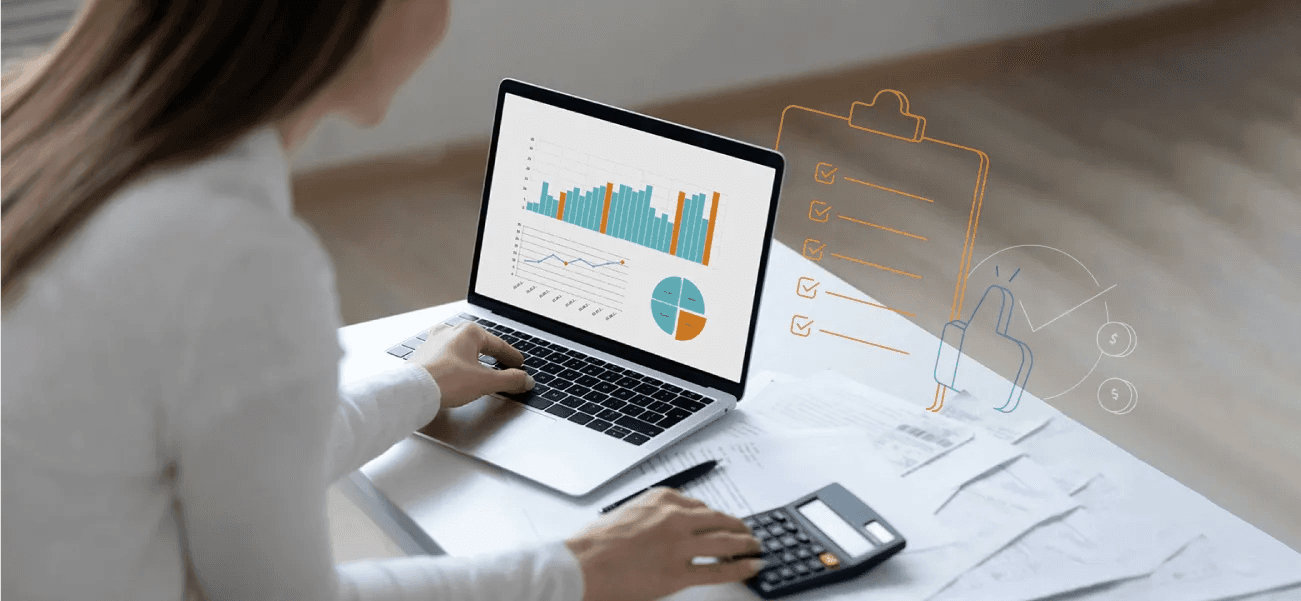 Woman reviewing charts - How to Categorize Small Business Expenses