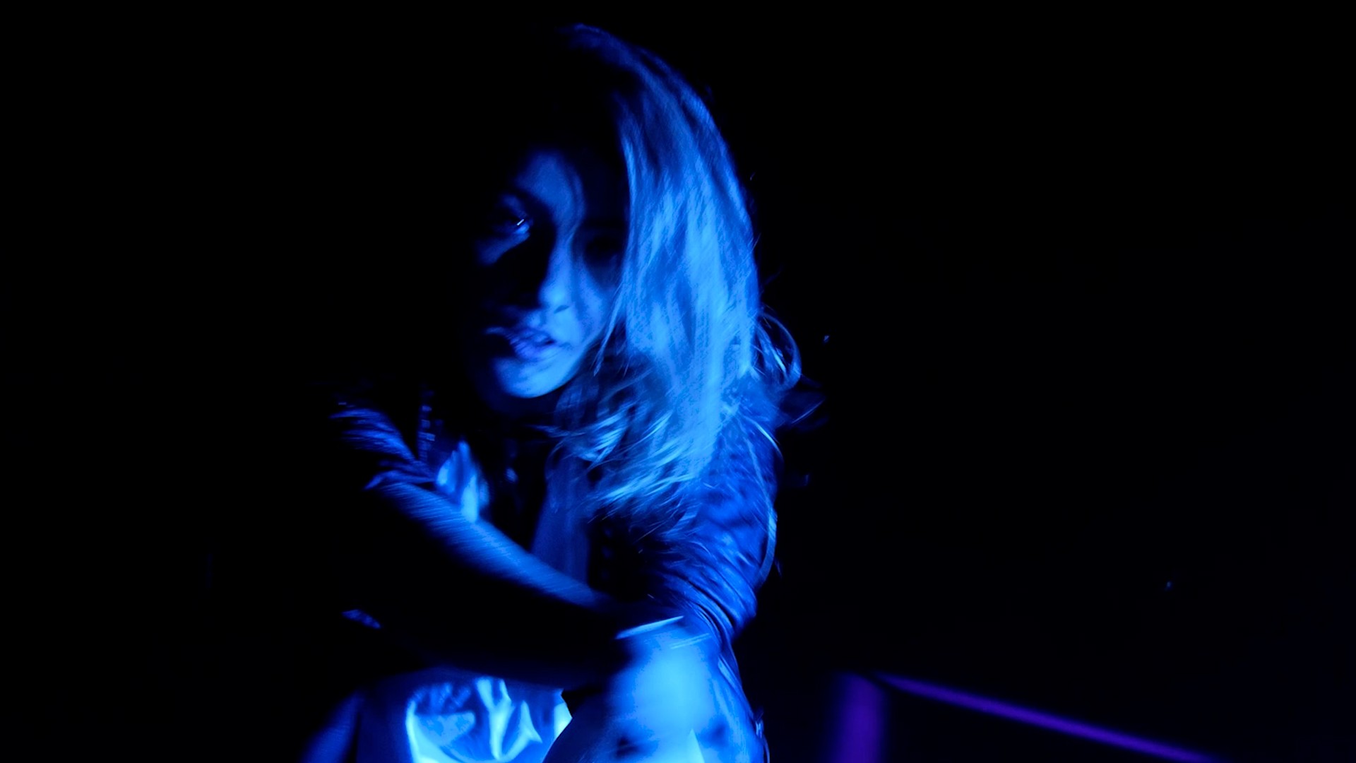 Cinematic music video sequence of woman dancing