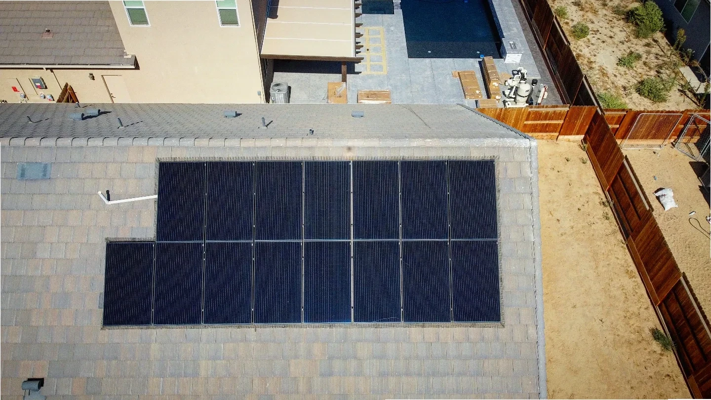 Drone top-down view of a rooftop solar array | Premier Solar Service