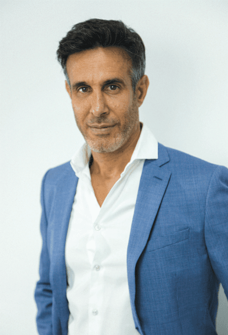 A surreal portrait of a person in motion, with light streaks and a blurred effect creating a dynamic and artistic vibe.